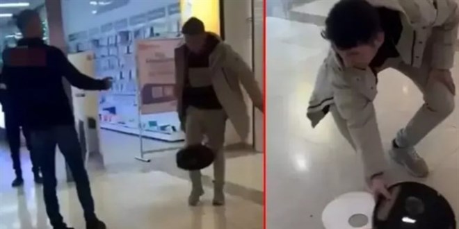 Süpürgesini mağazanın önünde parçaladı