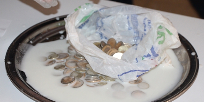 Dilenci topladığı paraları süt dolu bidona gizlemiş