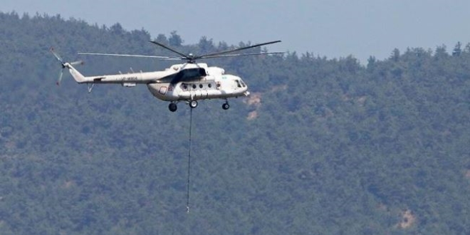İzmir'deki yangına 7 helikopter ve 3 uçağı müdahale ediyor