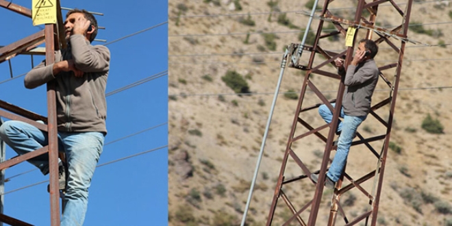 Telefonla konuşmak için elektrik direğine çıkıyorlar