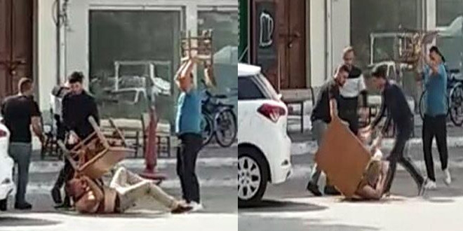 Masa ve sandalyelerle dövdüler