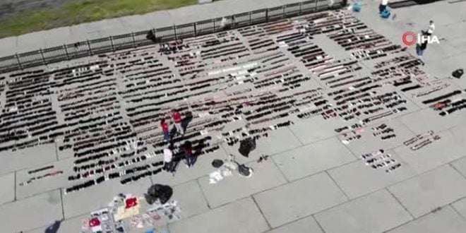 Selde ıslanan ayakkabılar Yenikapı'da kurutuluyor