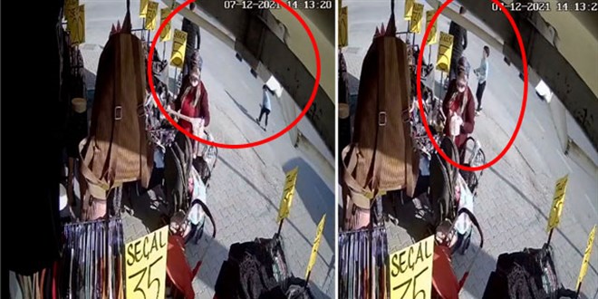 Yere düşen cüzdanı çocuğa aldırıp, cebine attı
