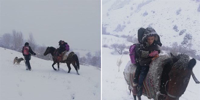 Kar yolu kapatınca, çocukları at sırtında okula götürdü