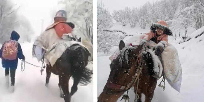 Kar yolu kapatınca çocukları at sırtında okula götürdü