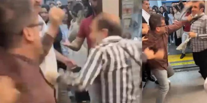 Metroda yumruk yumruğa kavga