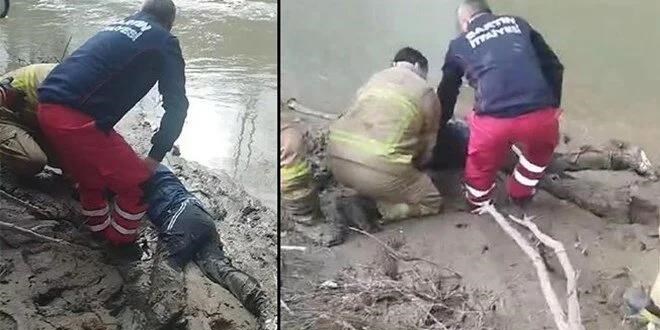 İntihar etmek için ırmağa gidiyordu, çamura saplanıp mahsur kaldı