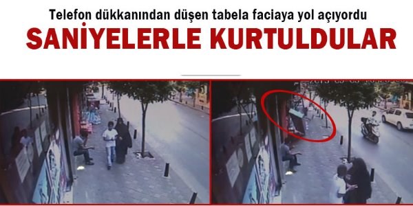 Düşen tabeladan saniyelerle kurtuldular