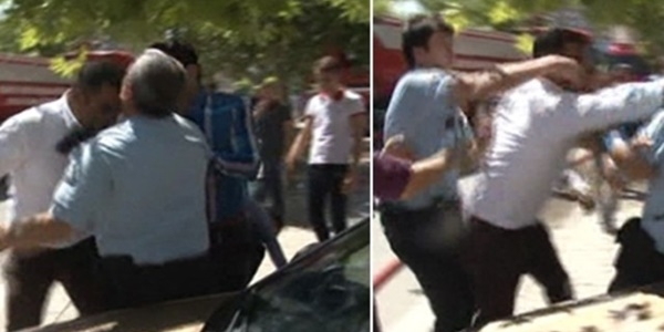 Biber gazı sıkan polise kafa attı