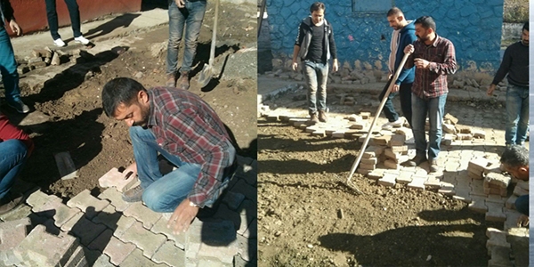 Çatışmaların harabeye çevirdiği okulu öğretmenler onarıyor