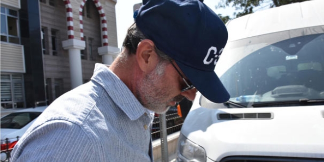 Ahlaks�zl���n foto�raf�n� �eken muhabir hakk�nda dava