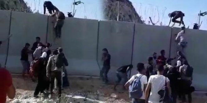 Duvara merdiven dayayıp Türkiye'ye kaçıyorlar