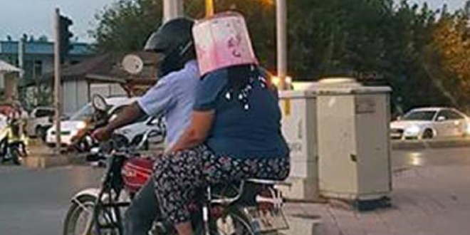 Motosiklette kask yerine kova taktı