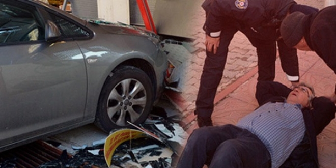Otomobilin viteslerini karıştırdı, markete girdi