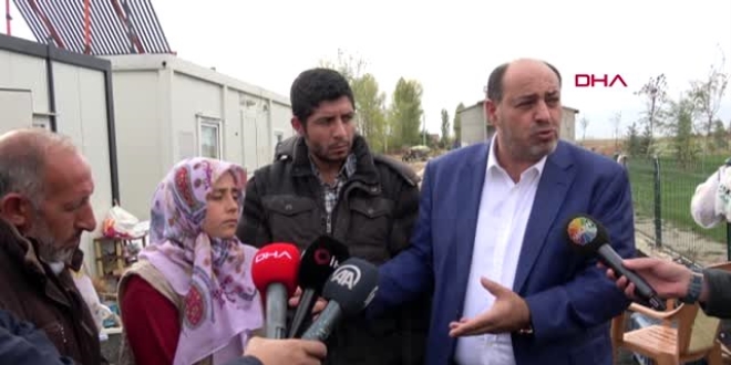 Evleri ve giysileri yanan aileye metafizik�i ziyareti