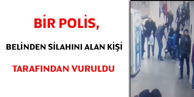 Bir polis, belinden silahını alan kişi tarafından vuruldu