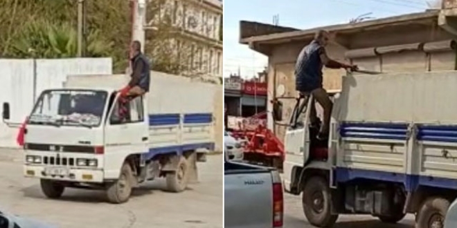 Kap�n�n �zerine oturup, kamyoneti ayaklar�yla kulland�