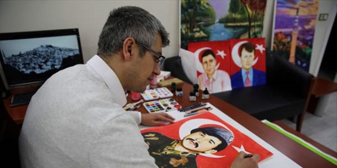 Ressam polis, �ehit meslekta�lar�n�n portrelerini �iziyor