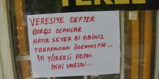 Hayırsever, bakkalın veresiye defterindeki borçları ödedi