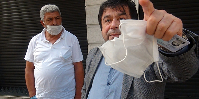 Sağlıkçıyım dedi, bekçiye kızarak maskeyi yırtıp yere attı