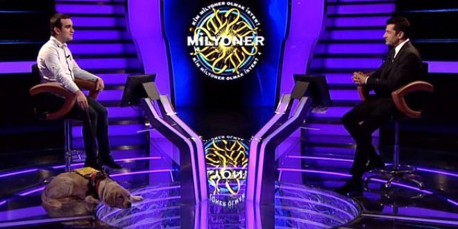 G�rme engelli avukat, k�pe�i ile kat�ld��� Milyoner'e damga vurdu