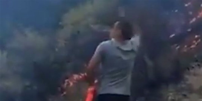 Helikopteri yönlendirmek isteyen vatandaş sırılsıklam oldu