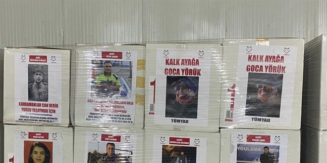 Şehitlerin fotoğraflarının yer aldığı yardım kolileri duygulandırdı