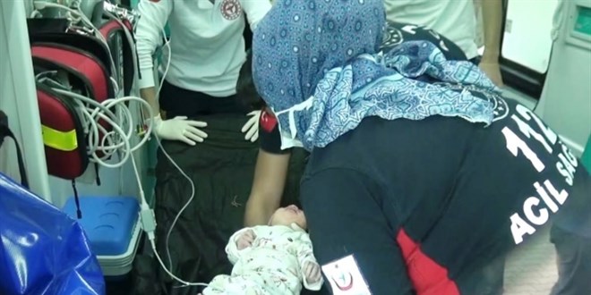 Bebe�i mezarl��a at�p v�cudunu topra�a g�md�ler